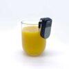 Uccello Liquid Level Indicator on the lip of a glass of orange juice