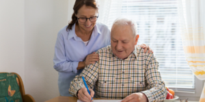 Occupational therapist with client at their home