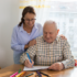 Occupational therapist with client at their home