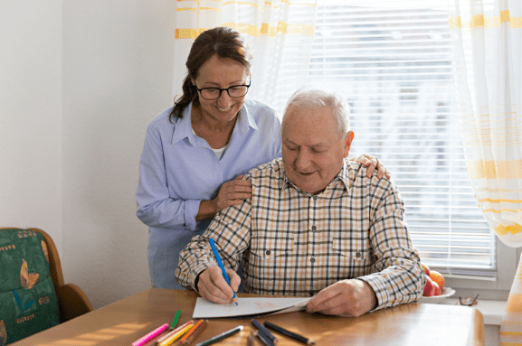 Occupational therapist with client at their home