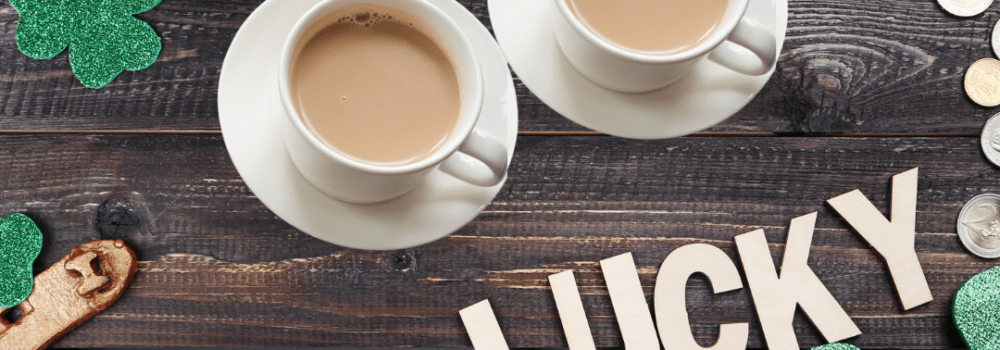 2 cups of tea with St. Patrick's Day items around them