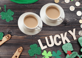 2 cups of tea with St. Patrick's Day items around them