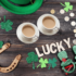 2 cups of tea with St. Patrick's Day items around them
