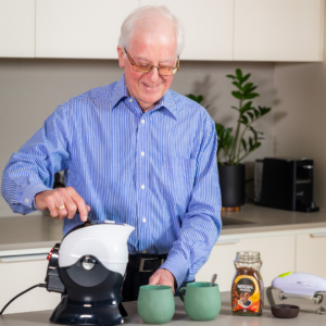 Elderly man making coffee with the Uccello Kettle