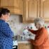 Mother and daughter in the kitchen making tea with the all white Uccello Kettle