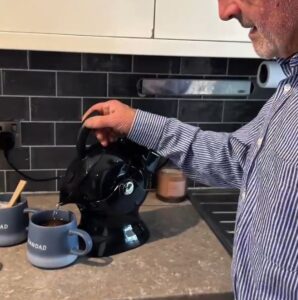 Elderly man with polymyalgia rheumatica making tea with the uccello kettle