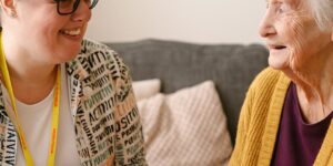 Occupational Therapist with Home visit of client enjoying a cup of tea together