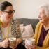 Occupational Therapist with Home visit of client enjoying a cup of tea together
