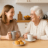 Adult woman drinks coffee with her Mother in the kitchen