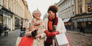 Middle aged women shopping the high street this Christmas