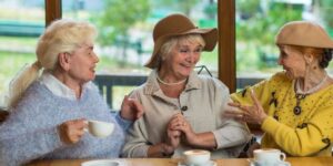 Elderly women enjoying tea together